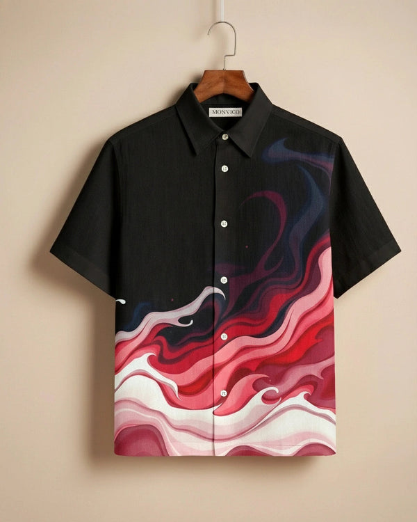 Black shirt with abstract red and white design on a beige background