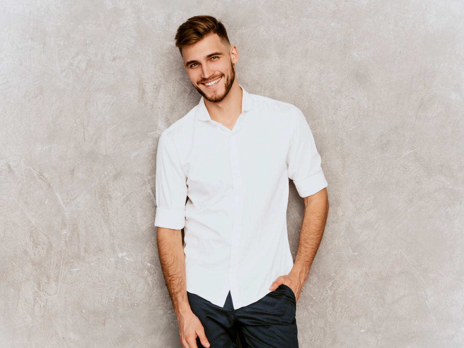 man wear white shirt and look at camera with confidence.