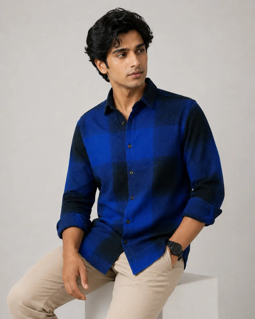 Blue and black check overshirt - front seated view