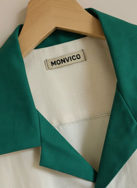 closeup off whiteshirt with green kolar 