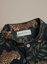 Close-up of a shirt collar with leopard and floral pattern and Monvico label.