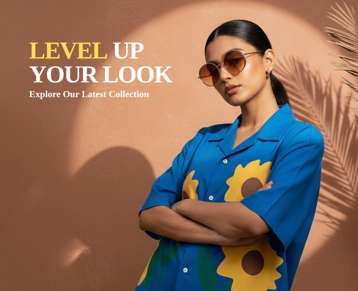 Woman wearing a blue shirt with sunflower designs and sunglasses, with text 'Level Up Your Look' on a brown background.